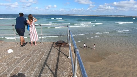 Saint Ive, Cornwall / England - 09/05/2019: People looking the beach in the Smeatons Pier 