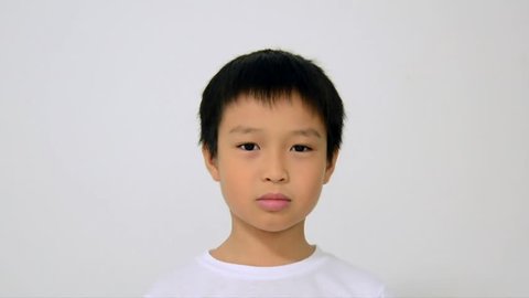 Asian boy sneeze on white background.