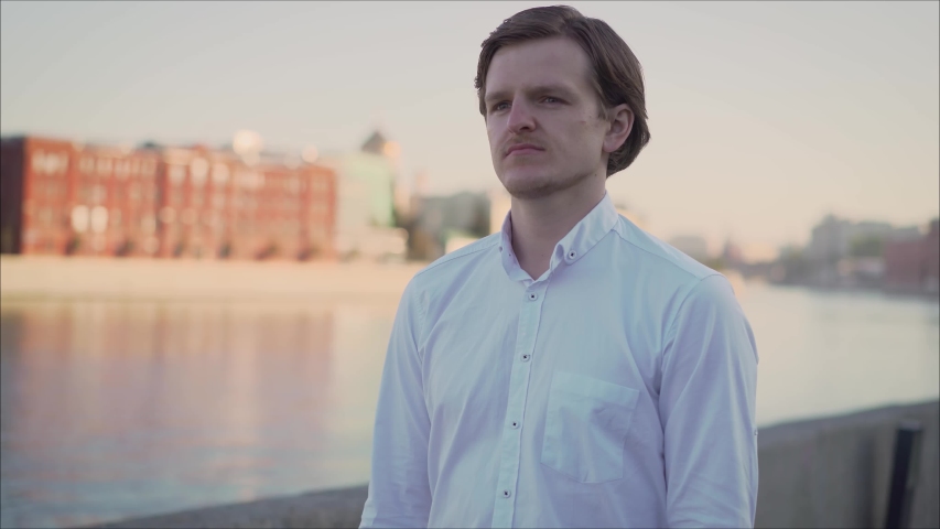 A guy is walking along the promenade in Moscow. Moscow embankment dawn.