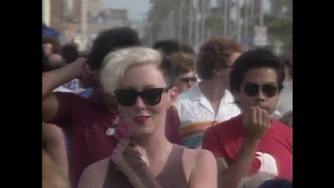 CIRCA 1984 - Street performers are shown in Venice Beach in California.