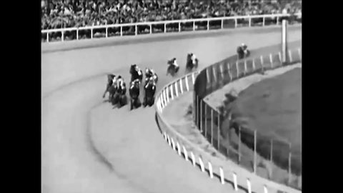 CIRCA 1941 Horses race at the Kentucky Derby, viewers place bets, a film crew records and the winner rides to the Winner's Circle,