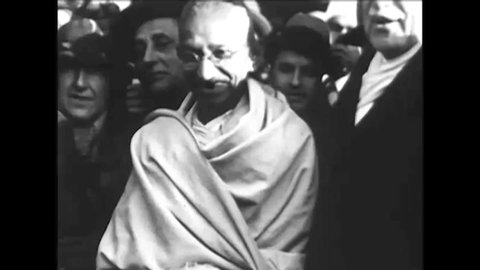 CIRCA 1930s Mahatma Gandhi speaks to a crowd in India