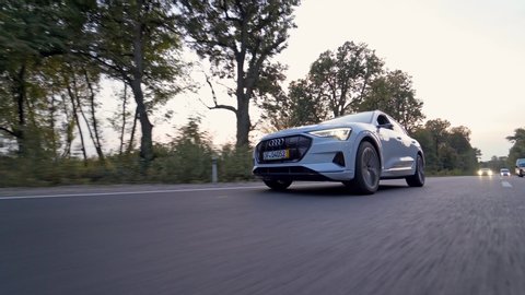 VINNITSA, UKRAINE - September 2019: Speeding Audi e tron on the highway. New Audi e tron fully electric vehicle ob highway