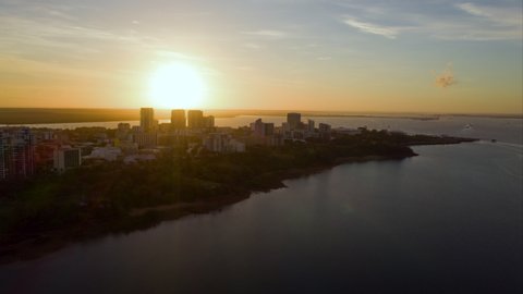 Time Lapse: Boats Crossing the Water in Front of Buildings on a Peninsula - Darwin, Australia