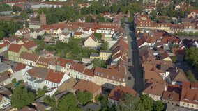 Aerial of the city Beeskow in eastern Germany on a sunny day in summer. Ascending beside the city.