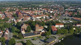 Aerial of the city Beeskow in eastern Germany on a sunny day in summer. Zoom in on the castle.