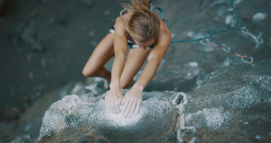 Young fit woman lead rock climbing outdoors, climber clipping into quick draw, cinematic slow motion rock climbing moment | Shutterstock HD Video #1037066192