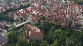 Aerial view of the city Lauf an der Pegnitz in Germany, Bavaria  on a sunny day in summer. Round pan to the left around the front of the city.