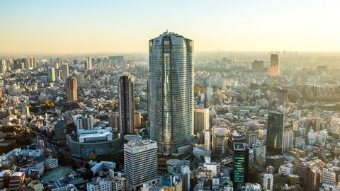 Tokyo, Japan - November 21, 2013 : High angle view of Roppongi Hills Mori Tower and Roppongi district time lapse zoom out