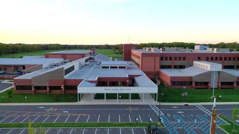 Monroe, NJ/United States - May 14, 2019: this video shows pull back aerial views of Monroe Township High School in New Jersey.   