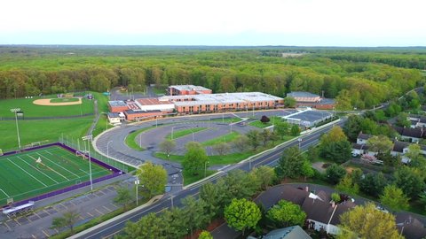Monroe, NJ/United States - May 14, 2019: this video shows pull back aerial views of Monroe Township High School in New Jersey. 