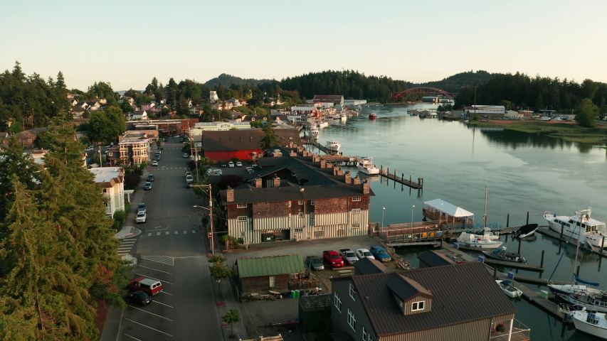 A boat trolls along the LaConner Washington waterfront after passing under the Rainbow Bridge