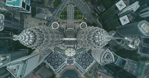 KUALA LUMPUR, MALAYSIA - SEPTEMBER 3, 2019 : Aerial bird eyes view of Petronas Twin Towers in Kuala Lumpur city centre. 4K