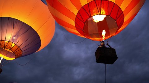 Hot air balloon ride scene. Hot air balloon sunset background with fire flashing 
