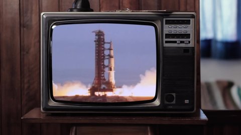 Apollo 11 Rocket Launch in an Old Vintage TV. Blue Dark Tone. Elements of this Video Furnished by NASA. 