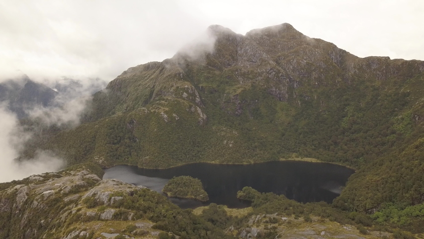 Fiordland New Zealand Aerial Moving Away from Large Lake with Fog