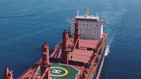 Flying over a cargo ship cruising northbound on Straits Bosporus. A bulk carrier or bulker is a merchant ship specially designed to transport unpackaged bulk cargo, such as grains, ore, coal or timber