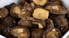 Portion of rotating dried Shiitake mushrooms in 4K UHD (seamless loopable)