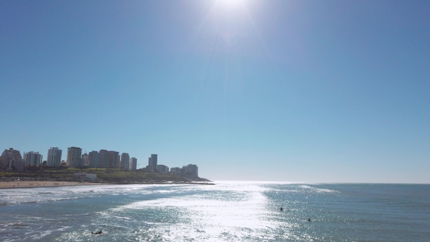 Surfers in famous Playa Grande Beach in Mar del Plata, Buenos Aires Province, Argentina