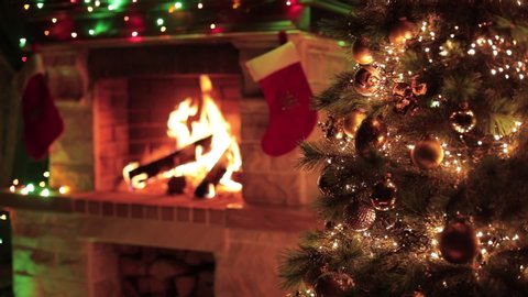 Christmas decorated tree closeup with fireplace interior