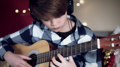 4k Home Music Practice, Child Playing Guitar with Headphones