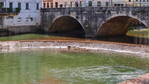 View on bridge to Contra Pusterla Street. Old buildings on Bacchiglione River in historic center of Vicenza, Italy.