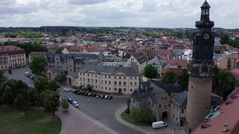 Weimar castle and church aerial drone view. City overview shot in Thuringia, Germany. Cloudy day in summertime above historic city center