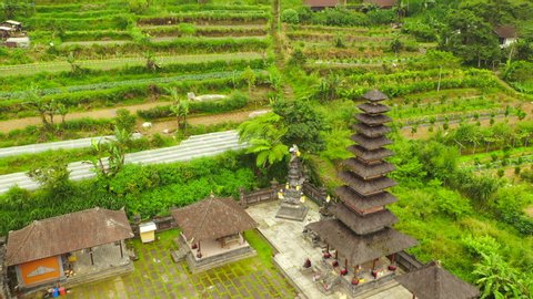 Aerial view traditional balinese hindu temple Pura Ulun Danu Buyan in Bali. Hindu water temple - culture symbol of Indonesia.