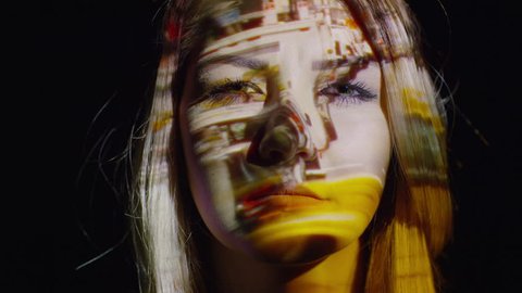 Close up shot of projections on stressed woman's face