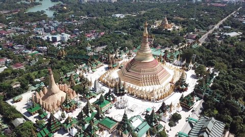 Shwedagon Pagoda in Yangon Myanmar Beautiful Buddhist temple golden pagoda great dagon pagoda sunny day clear sky amazing nature buddhas drone reveal