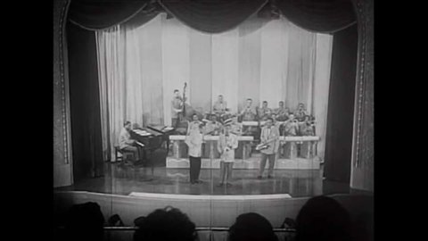CIRCA 1948- Ray Abrams and Shirley Green's band play Gator Serenade on a stage, and two saxophonist perform solos.