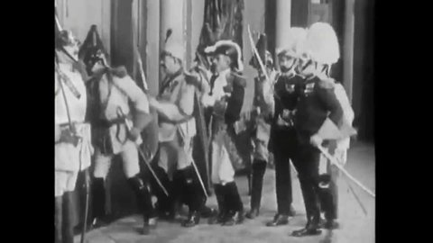 CIRCA 1920s-A man disguised as a guard and an heir apparent king fight, and the king calls for help from his guards.