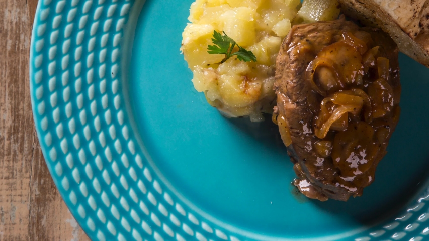 Fillet Mignon with sauté potatoes / Steak Beef with passion fruit sauce. Top view with smoke.