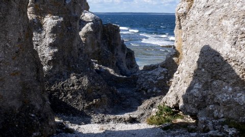Moving towards the sea between rock formation created by erosion on the shoreline of Gotland. Filmed in realtime.