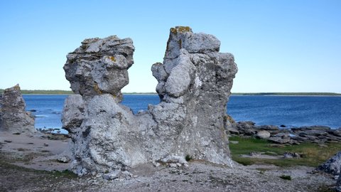 Rising shot showing the coastline of Gotland and some rock formation created by erosion. Filmed in realtime, camera moves upwards.