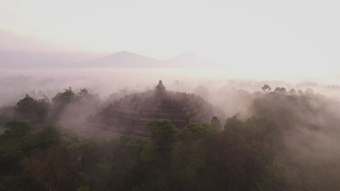 Aerial view 4K of Borobudur Temple in a misty surreal morning 