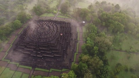 Aerial view 4K of Borobudur Temple in a misty surreal morning 