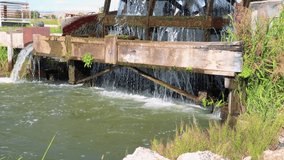 Old Vintage Water Wheel Spins As It Pulls Water From The Irrigation Ditch Slow Motion 20 Second Video.