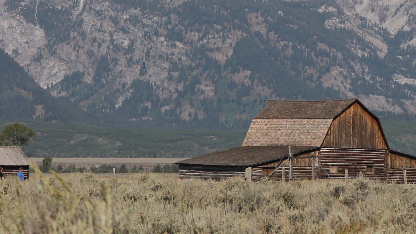 Grand Teton Mormon Row old barn mountain valley. Mountaineering, hiking, fishing and recreation. Over 2.5 million visitors a year. Geography, geology, environment, history.