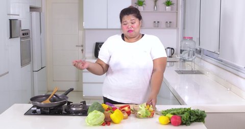 Happy Obese Woman Cooking Vegetables While Stock Footage Video (100%  Royalty-free) 1037239121 | Shutterstock