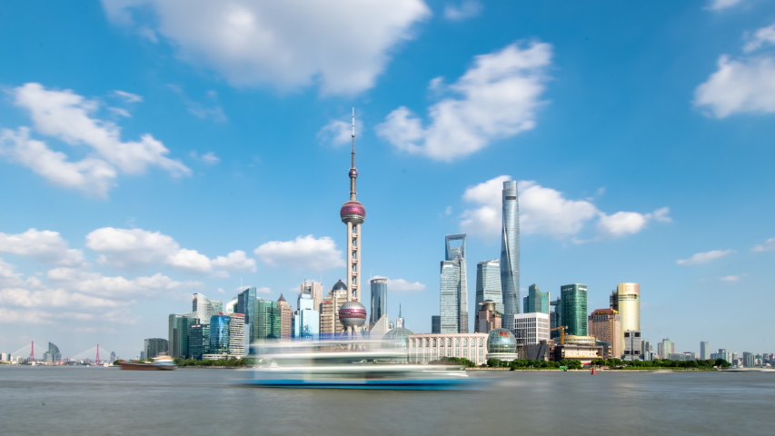Lujiazui Financial District under the blue sky and white clouds of time-lapse photography