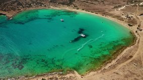 Aerial drone video of paradise round turquoise sandy beach of Pori in famous island of Koufonissi, Small Cyclades, Greece