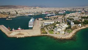 Aerial drone video of busy port of Piraeus, the largest in Greece and one of the largest passenger ports in Europe, Attica, Greece 
