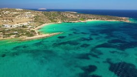 Aerial drone video of iconic breathtaking turquoise sandy beaches of Fanos and Finikas in famous island of Koufonissi, Small Cyclades, Greece