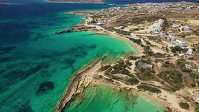 Aerial drone video of iconic breathtaking turquoise sandy beaches of Fanos and Finikas in famous island of Koufonissi, Small Cyclades, Greece