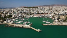 Aerial drone video of iconic round port of Mikrolimano, Piraeus, Attica, Greece