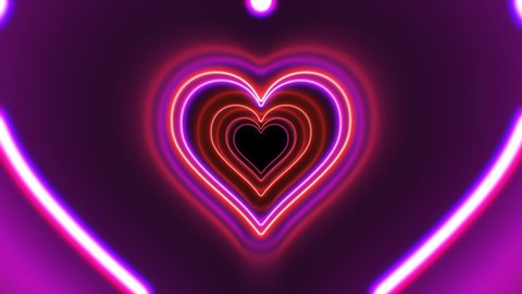 Beautiful Heart Shape Tunnel with Neon Light Lines Moving Fast Seamless. Abstract Romantic Futuristic Background Red, Pink, Purple Colors. Glowing Tunnel Looped 3d Animation. 4K Ultra HD 3840x2160.