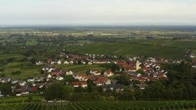 Aerial view around the villages Varnhalt, Steinbach and Neuweier in Germany. Early on a sunny morning in summer. Ascending beside the village.
