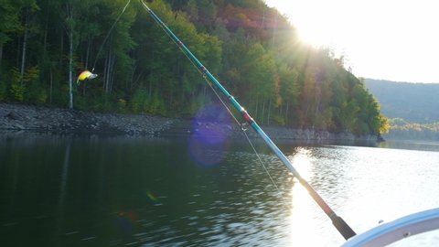 Fishing from boat to trolling in autumn at sunset