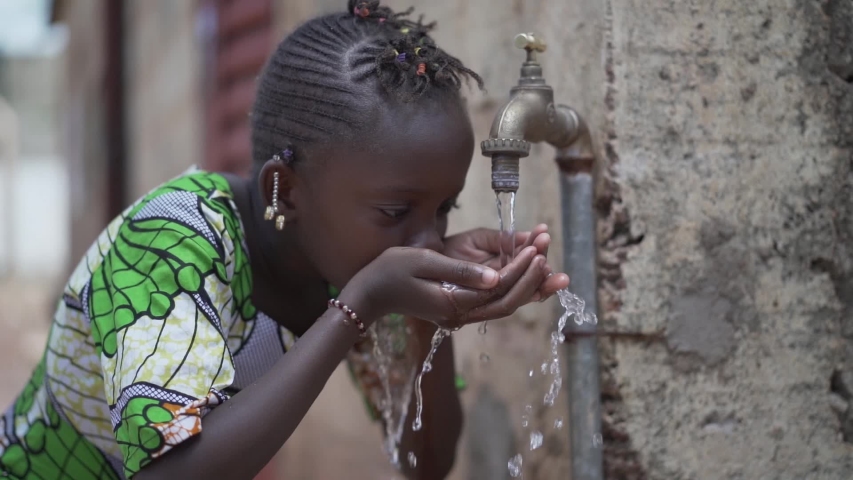 Slow Motion Candid Video of African Girl Women Drinking Fresh Clean Water from Tap in Bamako, Mali Royalty-Free Stock Footage #1037284241